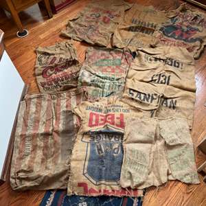 Lot #100 - Vintage Burlap Sack Collection - Various Brands and Designs.