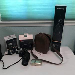 Lot # 34 - Pentax ME Super camera w/2 lenses, Polaroid flash kit, Nikon camera & more w/tripod