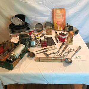 Lot # 55 - Vintage: grater, spoons, knives, cookie press, bakeware, and much more