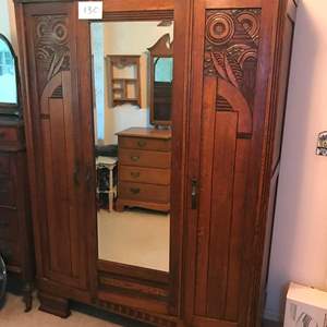 Lot # 130 - Gorgeous Antique wood carved wardrobe/beveled mirror. 54.75x17.75x77.5 tall