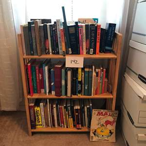 Lot # 142 - Small collapsible book shelf with books. 27.5x11x34hi