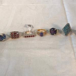 Lot # 289 - 7 Sterling Silver Rings w/ Precious Stones: amethyst, sapphire, ruby? - 47.17g.