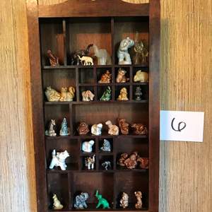 Lot # 6 - Shadow box, filled with small ceramic glass & stone animals. 11.5x2.75x20.5hi