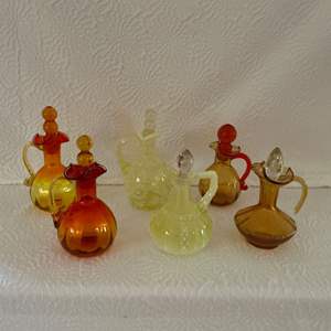 Lot #56 -   Lot of Amberina and Yellow Blown Glass Pitchers.