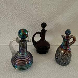 Lot #60 -  Lot of three decanters, including carnival glass