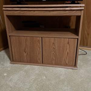 Lot #106 -   Small Television Stand with Rotating Top Shelf