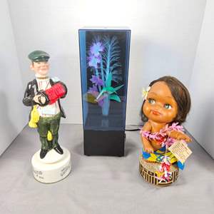 Lot #532 - Vintage Music Box Lot! - Hawaiian Girl, Accordion Player Decanter/ Music Box Plus 70s Fiber Optic Flowers Music Box 