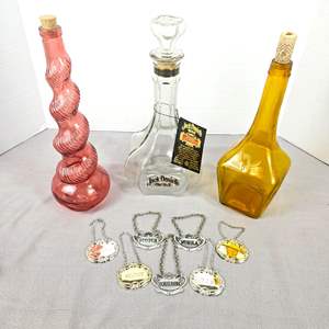 Lot #534 - Assorted Liquor Bottle Collectibles Including Jack Daniels Decanter Plus Vintage Silver Decanter Tags