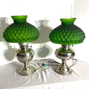 Lot #524 -  A beautiful pair of vintage green quilted glass converted oil lamps with ornate nickel plated bases