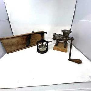 Lot #561 -  Vintage Kitchen Tools Lot - Meat Grinder, Potato Masher, and Wooden Board.