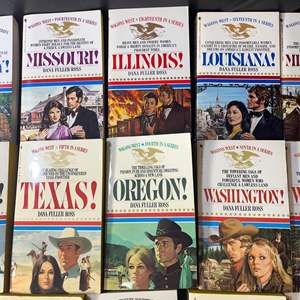 Lot #620 -  Collection of 24 Western Romance Paperback Novels - Wagons West Series by Dana Fuller Ross - Books