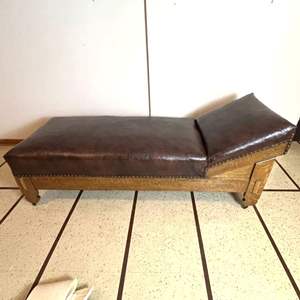 Lot # Vintage Vinyl Fainting Couch featuring a unique design with Original Casters & Brass Stud Accents.