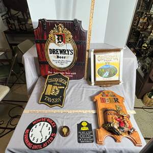 Lot #508 -  This auction lot includes a selection of vintage bar signs including a Drewry's Beer sign, a Golden Spike Tavern sig