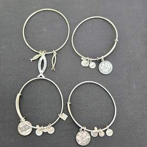 Lot #294 (4) Alex & Ani Bracelets w/ Variety of Charms