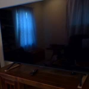 Lot #356  Like new 65" Samsung 4K TV w/remote (pictures don't show how great it is) ultra thin