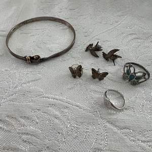 Lot #61 - Marked Sterling Hummingbird and butterfly earrings, and rings 