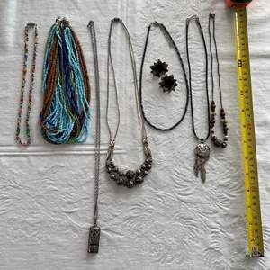 Lot #68 - 7 necklaces, 1 pair pierced earrings, 1 whistle necklace