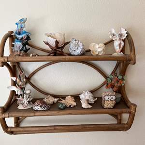 Lot #267 - Rattan hanging shelf and seashells collectibles