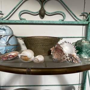 Lot #346 - Shelf with shells, brownie tin, brass planter, blue rock