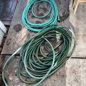 Lot #402 - Pair of garden hoses