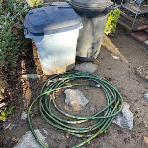 Lot #406 - Garden Hose & 2 trash cans