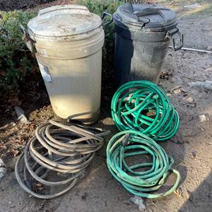 Lot #407 - 3 Garden hoses & 2 trash cans 