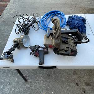 Lot #418 - Garage light, clip lamp, glue gun, belt sander, air compressor, hose, car brush