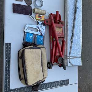 Lot #440 - Staple gun, floor jack, spark plugs, carpenter's square, bag windshield screen