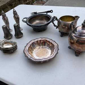 Lot #470 - Silver plate cream and sugar, 2 bowls, 2 sets of salt & pepper shakers, nut dishes