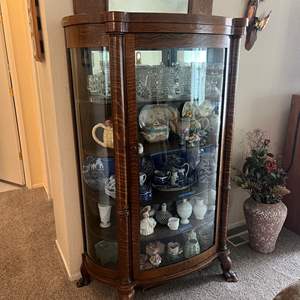 Lot #158 - Lovely Claw foot oak curved glass cabinet Cabinet only (does not include the mirror in the picture or any contents )