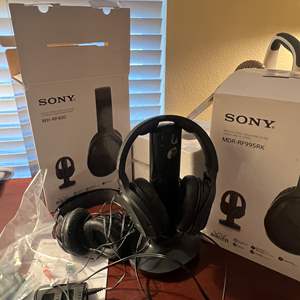 Lot #213 - Pair of Sony wireless headphones and Soho cell phone not tested