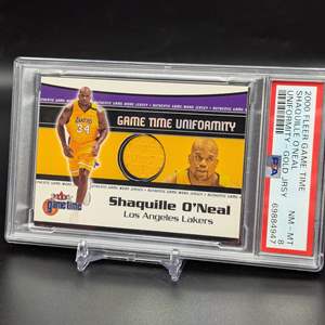 Lot #262 - 2000 Shaquille O'Neal Fleer Game Time Uniformity Game Worn PSA 8