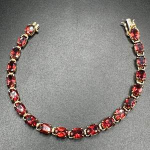 Lot #3 - 14k gold and garnet bracelet (appraisal included $2375.)