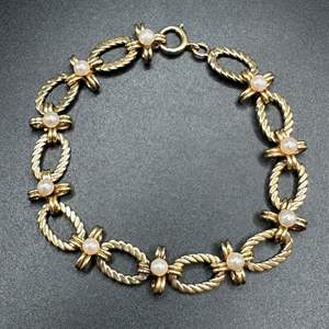 Lot #5 - 14 karat gold bracelet with ten, 3.4 mm pearls (17.5g)