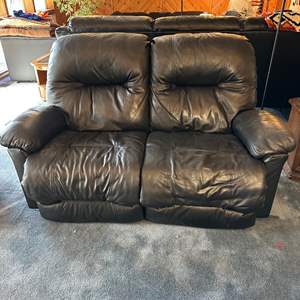 Lot #26 - Leather reclining love seat