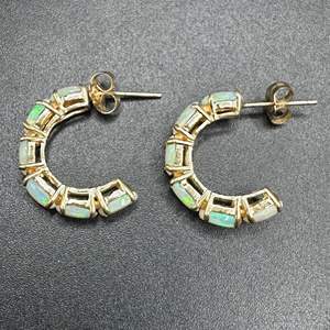 Lot #124 - opal and 14 karat gold hoops 