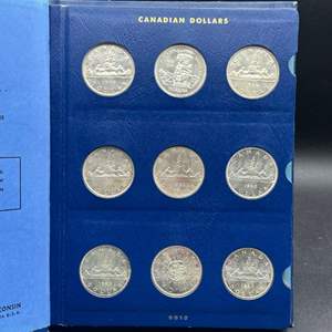 Lot #224 - 1957-1967 Canadian Silver Dollars in book, 11 total coins 