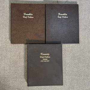 Lot #228 - Empty Dansco Liberty, Franklin, and Kennedy coin albums 