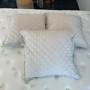 Lot #9 - Three oversized pillows 26” square