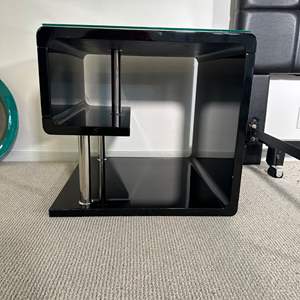 Lot #94 - 2 matching modern black lacquer with glass top end tables