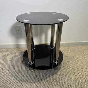 Lot #96 - Modern round end table, black and chrome