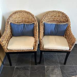 Lot #113 - Two wicker & Wood Chairs with down feather back pillows, each with blue and cream slip cases