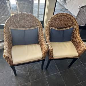 Lot #115 - Two wicker & Wood Chairs with down feather back pillows, each with blue and cream slip cases