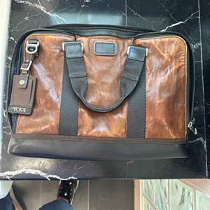 Lot #164 - Tumi soft-sided briefcase in good condition