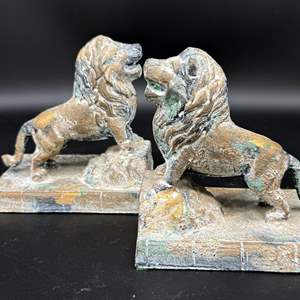 Lot #224 - Pair of Hollywood Regency Cast Iron Lion Bookends