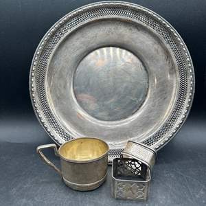 Lot #107 - Sterling silver plate, cup, and napkin rings (286g)