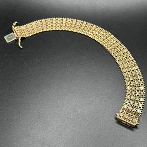 Lot #152 - 14k gold wide-bracelet (29.4g)