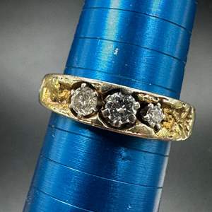 Lot #196 - 14k gold band with natural nuggets around the .4c total of diamonds (4.6g)