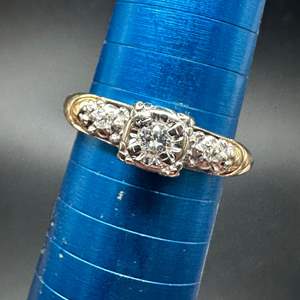 Lot #199 - 14k gold wedding band with .25c diamond (2.8g)