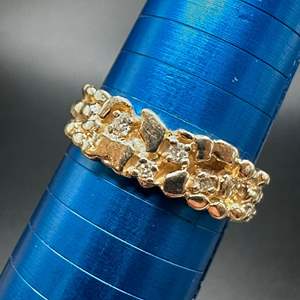 Lot #200 - 14k hold band with .20c total of diamonds (5.3g)